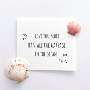 "I love you more than all the garbage in the ocean" card with seashells